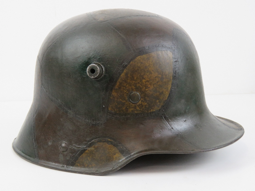 A WWI German M16 Camo Helmet Stahlhelm, with liner.