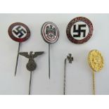 A quantity of German badges and stick pins; Iron Cross, SS, 'gold' wound, DDAC,