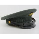 A US Army Vietnam War peaked cap, size 7, named within for Neal Clennstruy.