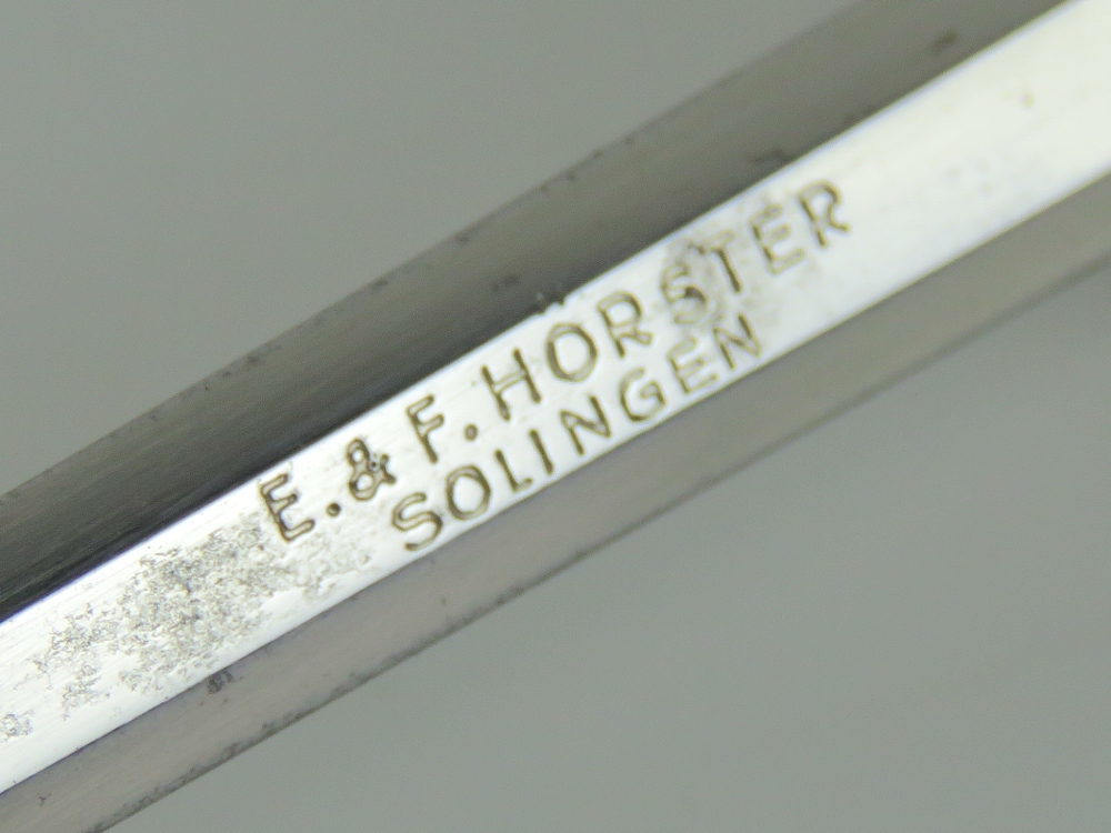 A letter opener in the form of a miniature WWII German Army dagger, marked for E&F Horster Solingen. - Image 4 of 5