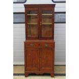 An oak bookcase on chest, twin glazed do