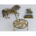 A brass lion ardent trivet together with