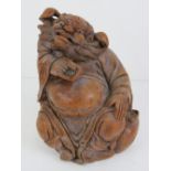 A carved bamboo Oriental deity figure st