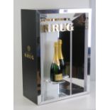 A contemporary illuminated Krug champagn