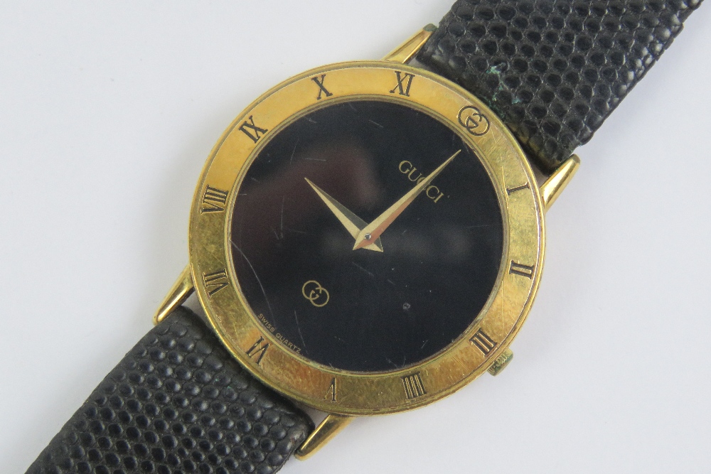 A Gucci wristwatch having yellow metal c