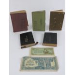 A set of Japanese soldiers pay books and technical manuals with 2 pieces of paper money and