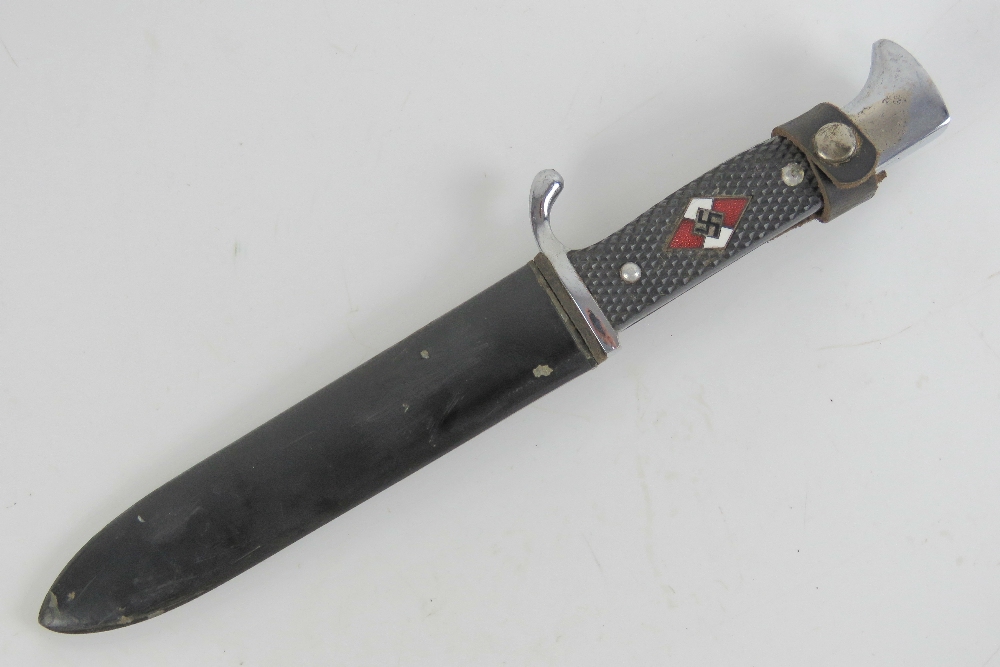 A Hitler Youth knife with scabbard, having engraving to the blade.