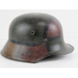 A WWI German M16 camo helmet, repainted.