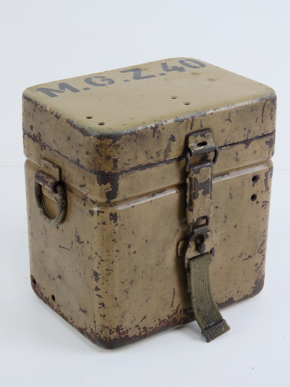 A WWII MG34/42 Lafette scope transit tin, Afrika Korp colours with stencilling upon.