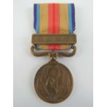 A WWII China incident medal with ribbon in box.