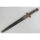 A long Lee Enfield bayonet marked indistinctly (Wilkinson Sword?) and having inspection marks to