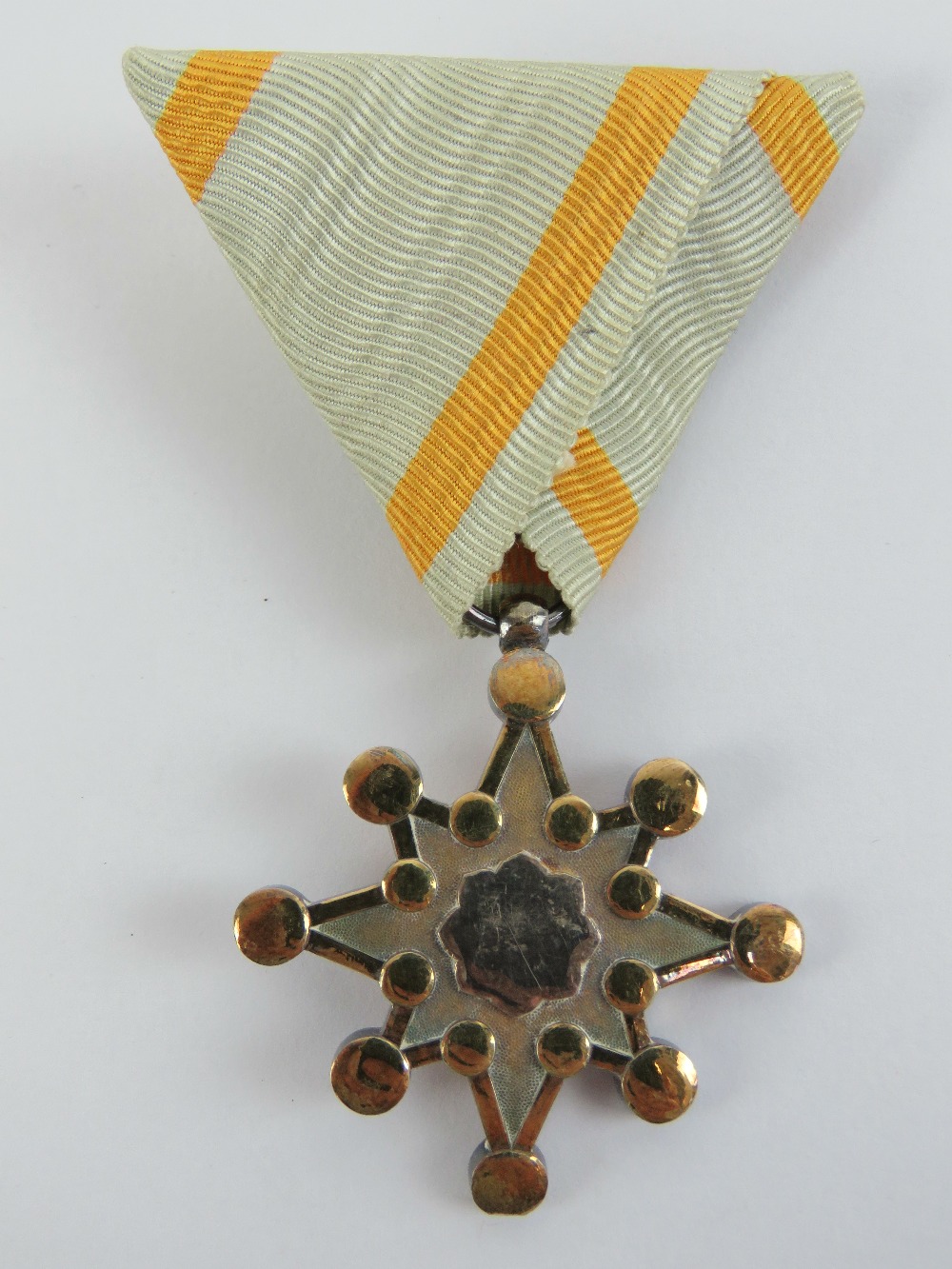 A Japanese sacred treasure 7 medal with ribbon, in box.