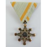 A Japanese sacred treasure 7 medal with ribbon, in box.