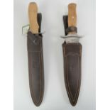 Two large Joker knives with scabbards.