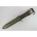 A WWII US M8 fighting knife with scabbard.