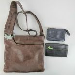 A brown leather Radley handbag, together with two Radley purses. Three items.