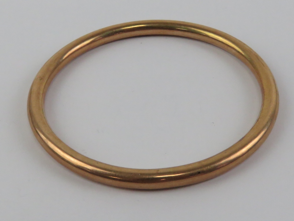 A 9ct rose gold hallmarked bangle, approx 8cm internal dia, 13.7g.