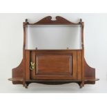 An Edwardian mahogany wall cabinet with shelf over, 72 x 65cm.