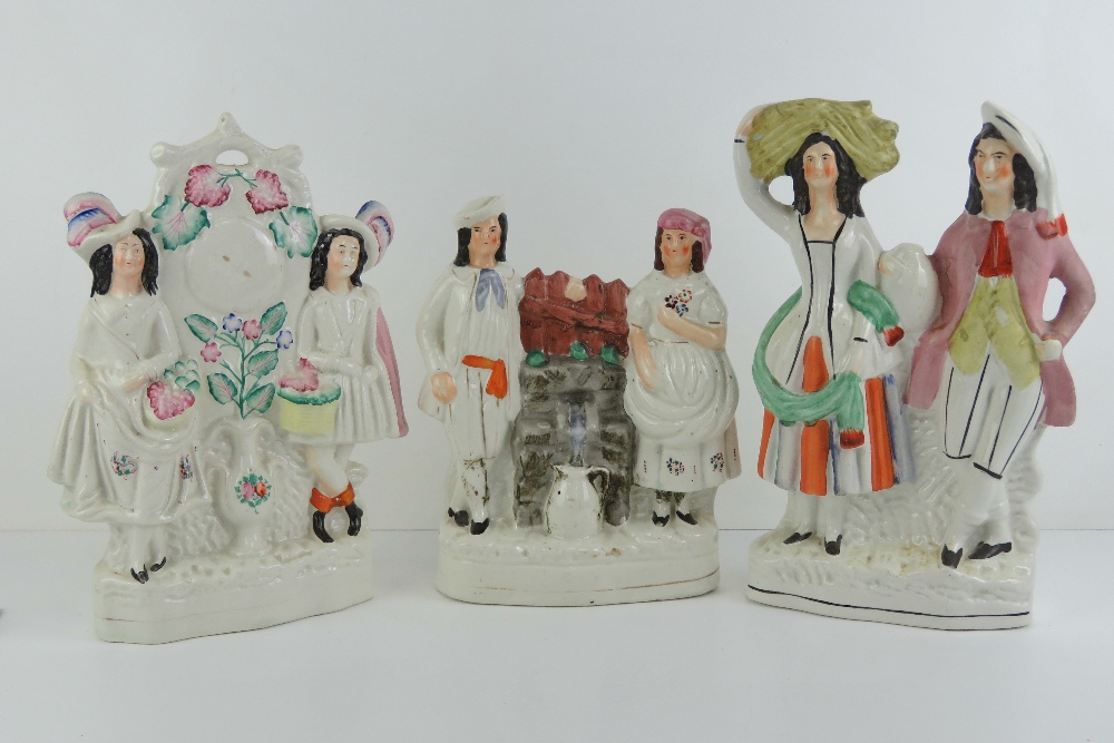 Three 19th century Staffordshire flatback figurines each being of a man and a woman,