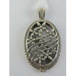 A HM silver 'open locket' having pierced floral panels to front and back, opening at bale, 4.