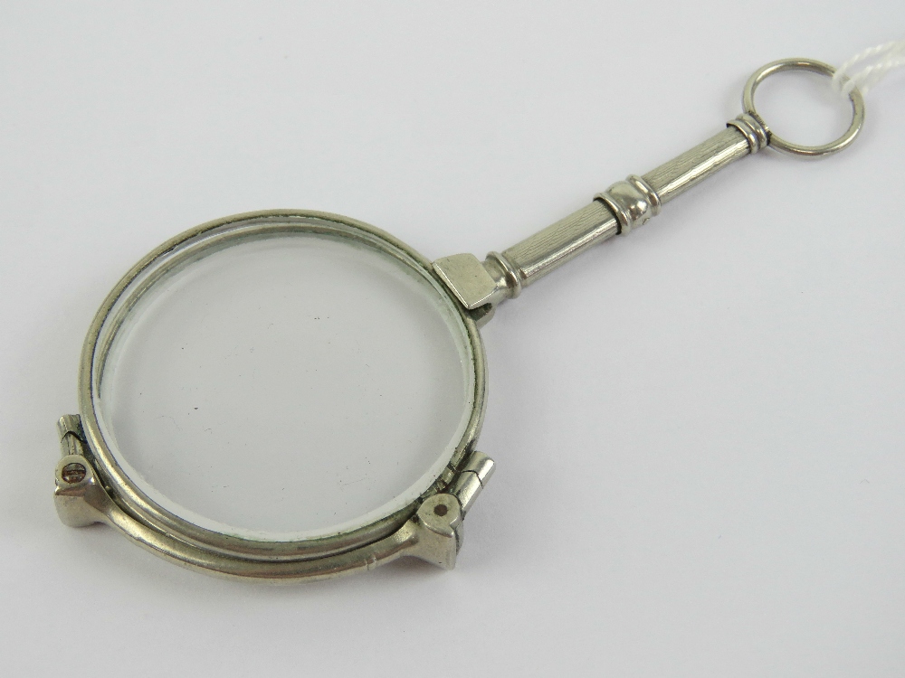 A pair of Art Deco folding lorgnette spectacles, having pendant loop to end,