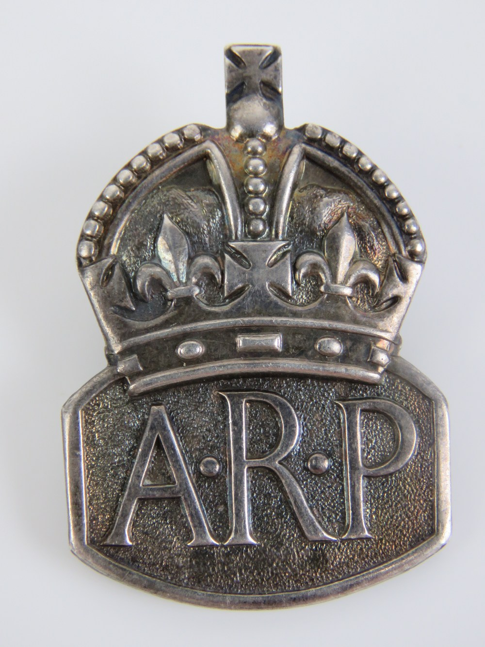 A HM silver ARP lapel badge, hallmarked London 1938.