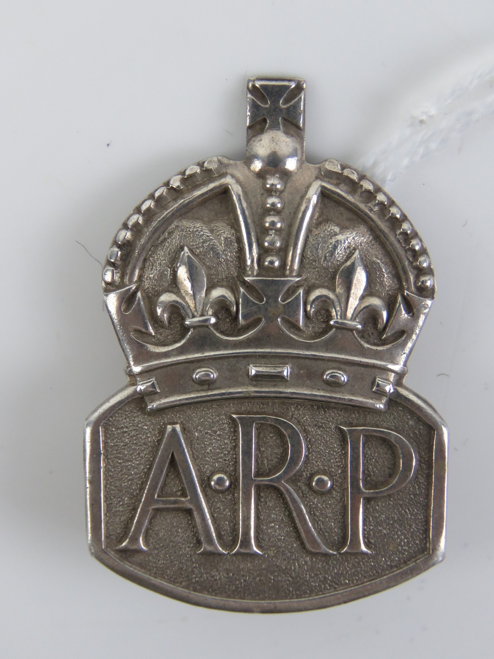 A HM silver ARP badge, hallmarked London 1938.