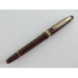 A Montblanc Meisterstuck 144 Classique Burgundy Fountain pen, 1997-99 model, having 14k gold nib,