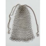 A delightful vintage metal chain link ladies purse having chain drawstring with acorn finials.