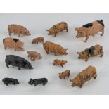 A quantity of assorted Britains hand painted lead pigs and piglets, fourteen in total.
