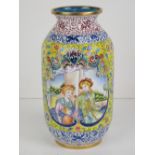 A Chinese Canton enamel on brass vase having European scenes upon a yellow ground with further