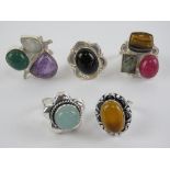 Five hardstone rings each stamped 925, size O-P, including tigers eye and onyx.