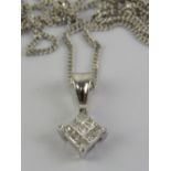 An 18ct white gold and diamond pendant on a 9ct white gold fine chain necklace,