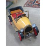 A 'Brum' peddle car having powder coated paint, steel construction,