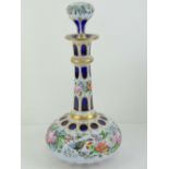 A delightful overlaid glass decanter of bulbous form, handpainted with birds, roses, peonies, etc,