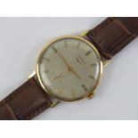 A 9ct gold Longines wristwatch having silvered dial with yellow metal hands, case hallmarked 375,