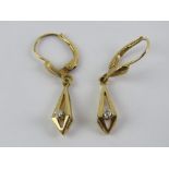 A pair of 9ct gold and diamond earrings, hallmarked 375 to the hanger, 2.1g.