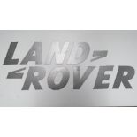 A rare solid metal font-correct 'Land Rover' wall sign comprising the eleven individual pieces,