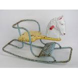 A vintage Tri-ang rocking horse, 67cm in length.
