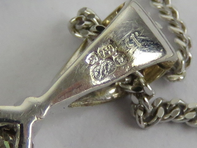 An 18ct white gold and diamond pendant on a 9ct white gold fine chain necklace, - Image 3 of 3