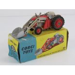 A Corgi Massey Ferguson 65 tractor with front loader and shovel, in original box.