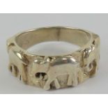 A 925 silver ring having trio of elephants upon, size O.