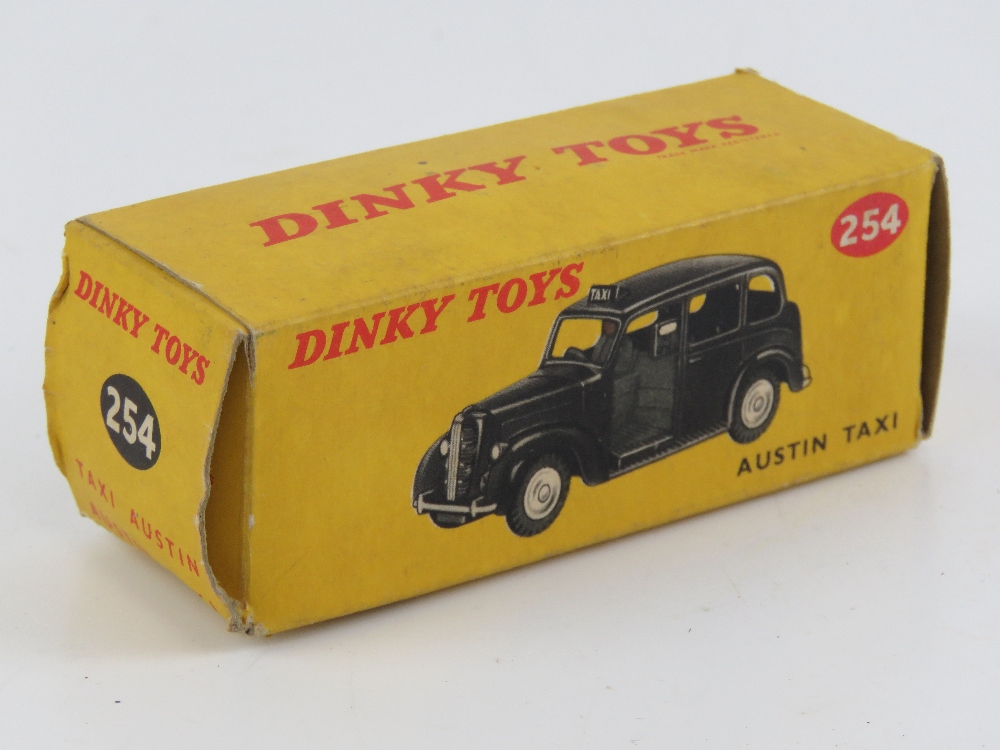 A Dinky Toys Austin Taxi No254, together with a Cogri Toys Taxi No418. Two items in original boxes. - Image 9 of 9