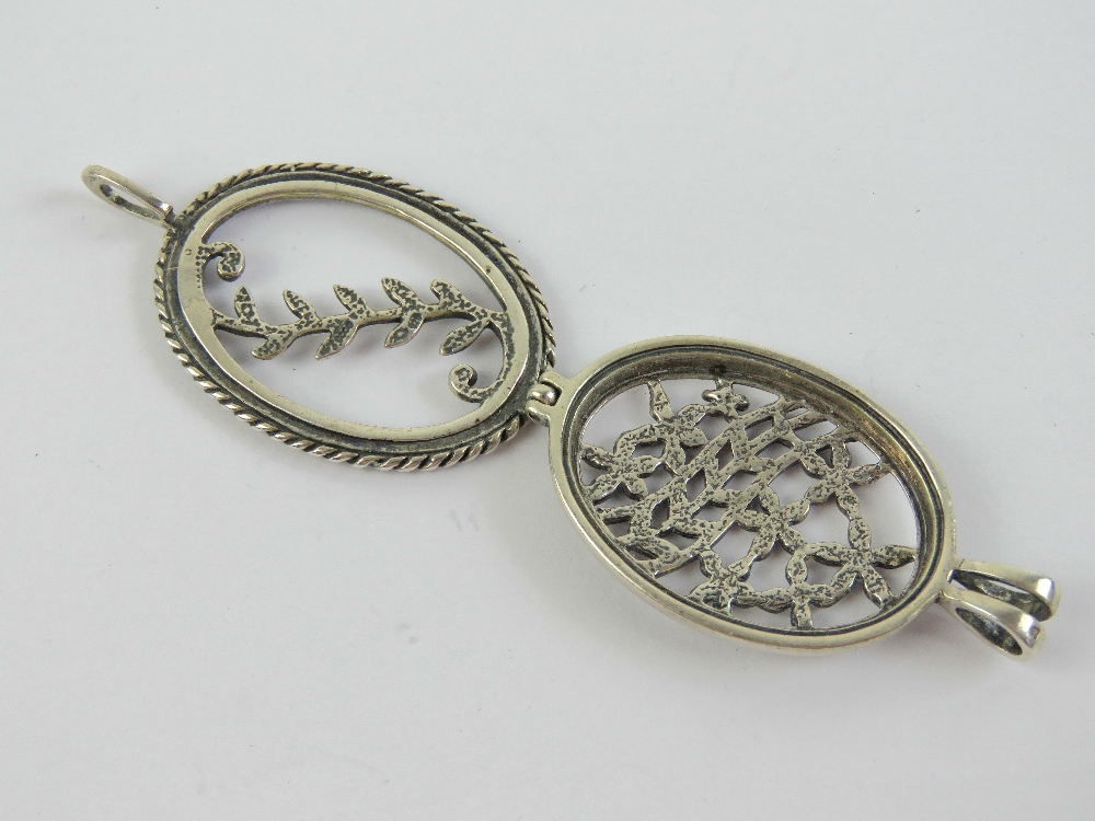 A HM silver 'open locket' having pierced floral panels to front and back, opening at bale, 4. - Image 2 of 3