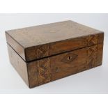 A Tumbridge ware walnut veneered work box, lid lifting to reveal pin cushion etc within, 29cm wide.