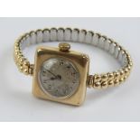 A 9ct gold ladies cocktail watch on expanding Excalibur bracelet, having london import hallmarks,