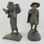 Two cast brass Oriental figurines being man and woman, each standing approx 21cm high.