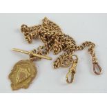 A 9ct gold Albert watch chain complete with T-bar, two clasps and fob medallion,