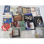 A quantity of commemorative and proof coin sets including; 1990, 1997, 2000, 2007,