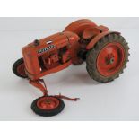 A scale model cast metal Nuffield tractor as made by Denzil Skinner Ltd.